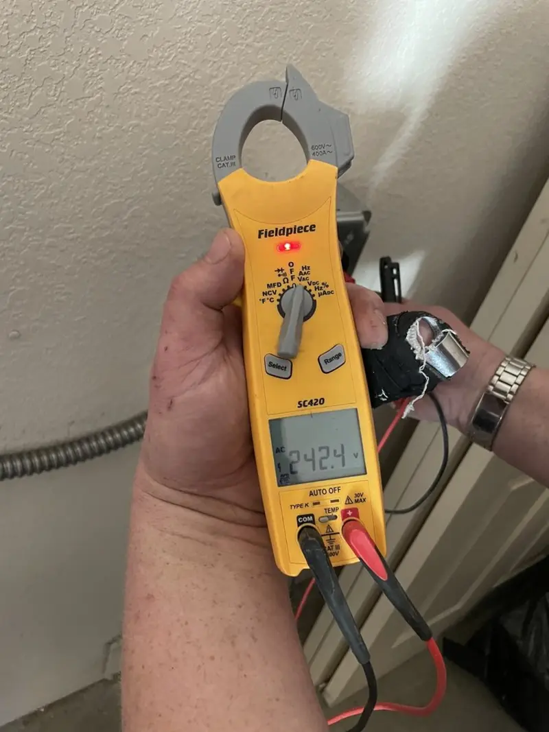 Voltage testing with clamp meter during Ceiling Fan Installation in Montgomery